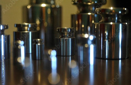 Closeup shot of different metal wight measurements on a table photo