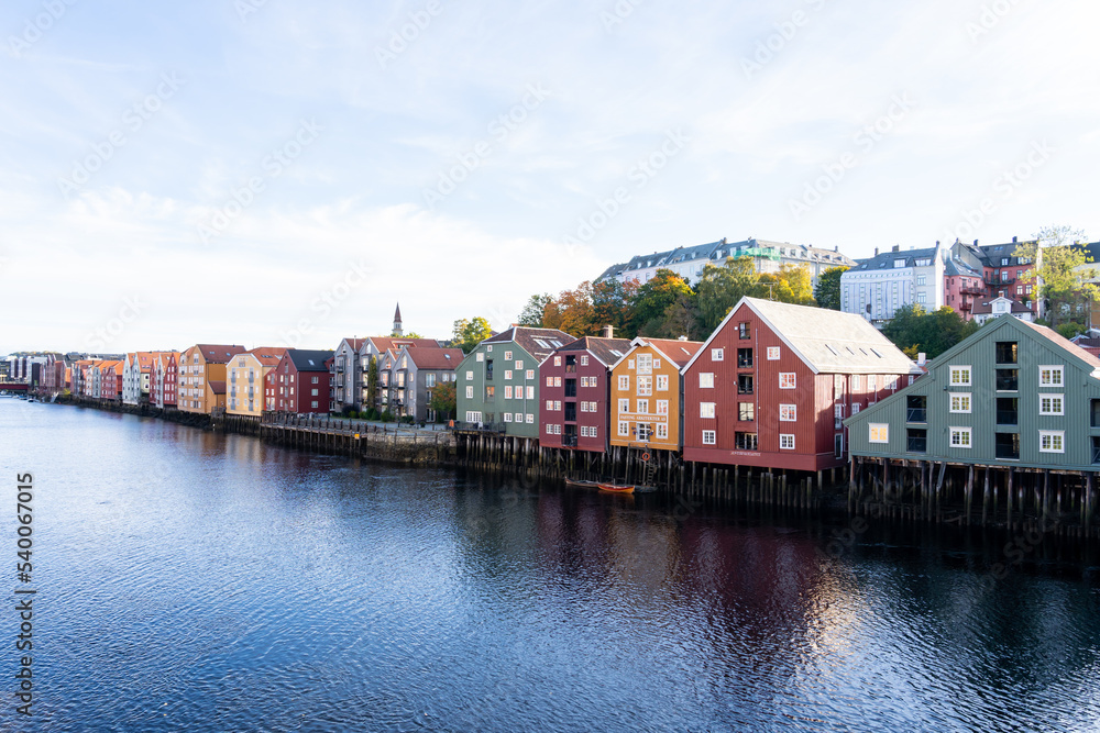 Trondheim, Norway - October 1, 2022: Waterfront colorful houses in Bakklandet, a neighborhood in the city of Trondheim, Norway. 