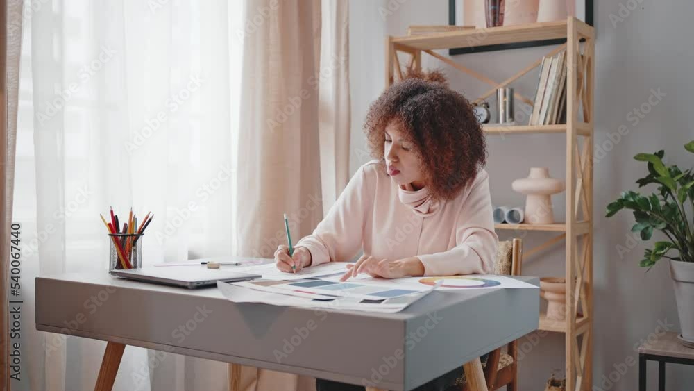African American woman projector works on interior design