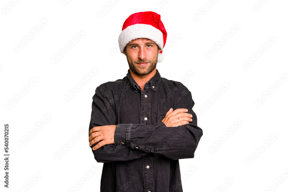 Young caucasian man celebrating Christmas wearing a santa hat isolated laughing and having fun. Young caucasian man celebrating Christmas wearing a santa hat isolated laughing and having fun.