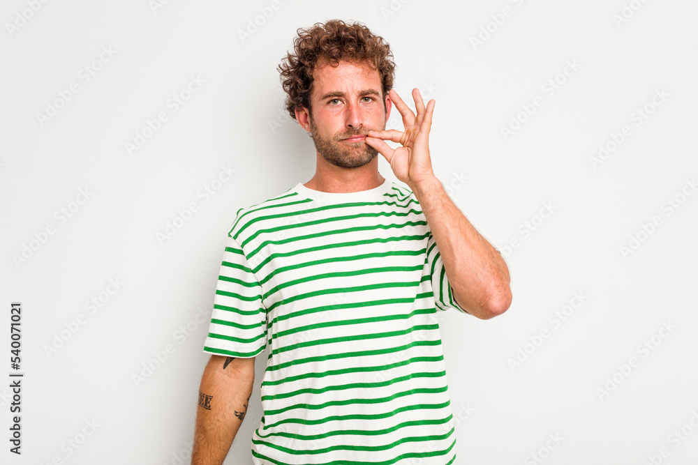 Young caucasian curly hair man isolated on white background with fingers on lips keeping a secret. Young caucasian curly hair man isolated on white background with fingers on lips keeping a secret.