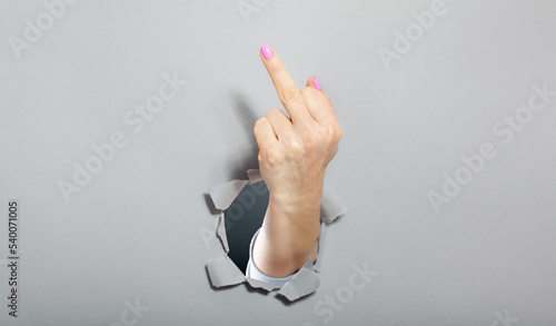 Фотография Woman hand shows with a gesture that everything middle finger