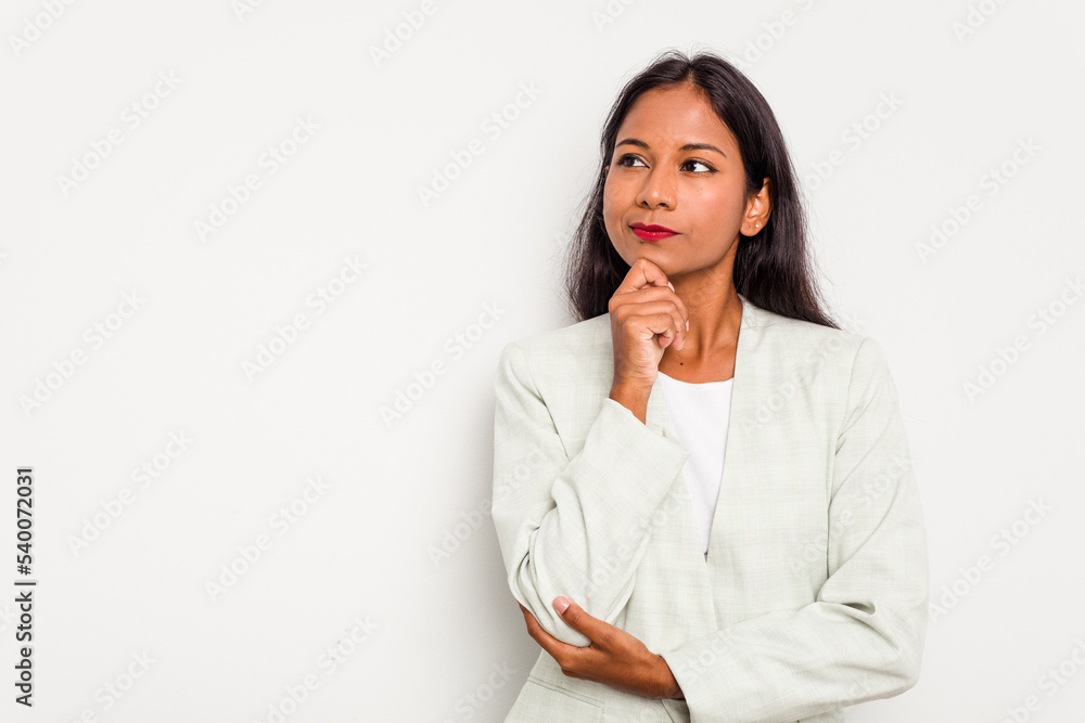Young business Indian woman isolated on white background looking sideways with doubtful and skeptical expression. Young business Indian woman isolated on white background looking sideways with doubtful and skeptical expression.