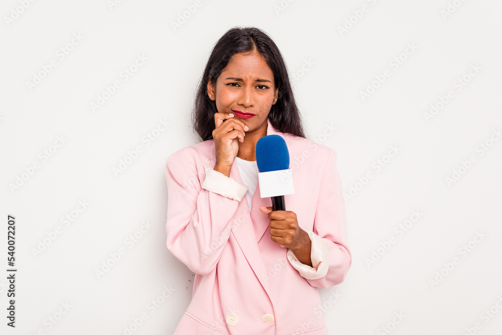 Young TV presenter indian woman isolated on white background biting fingernails, nervous and very anxious. Young TV presenter indian woman isolated on white background biting fingernails, nervous and very anxious.