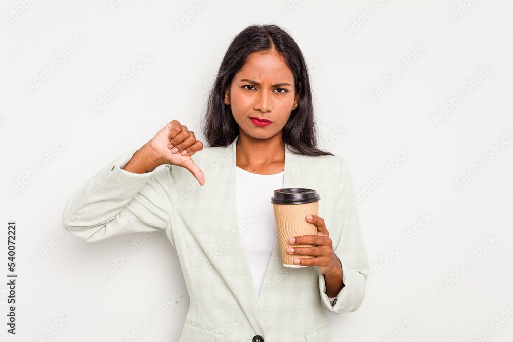 Young business Indian woman holding takeaway coffee isolated on white background showing a dislike gesture, thumbs down. Disagreement concept. Young business Indian woman holding takeaway coffee isolated on white background showing a dislike gesture, thumbs down. Disagreement concept.