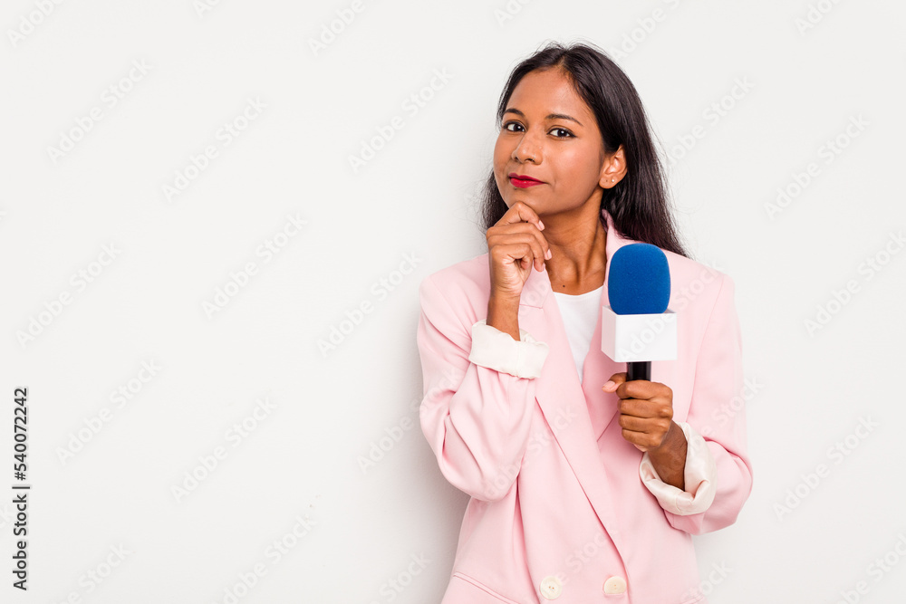 Young TV presenter indian woman isolated on white background looking sideways with doubtful and skeptical expression. Young TV presenter indian woman isolated on white background looking sideways with doubtful and skeptical expression.