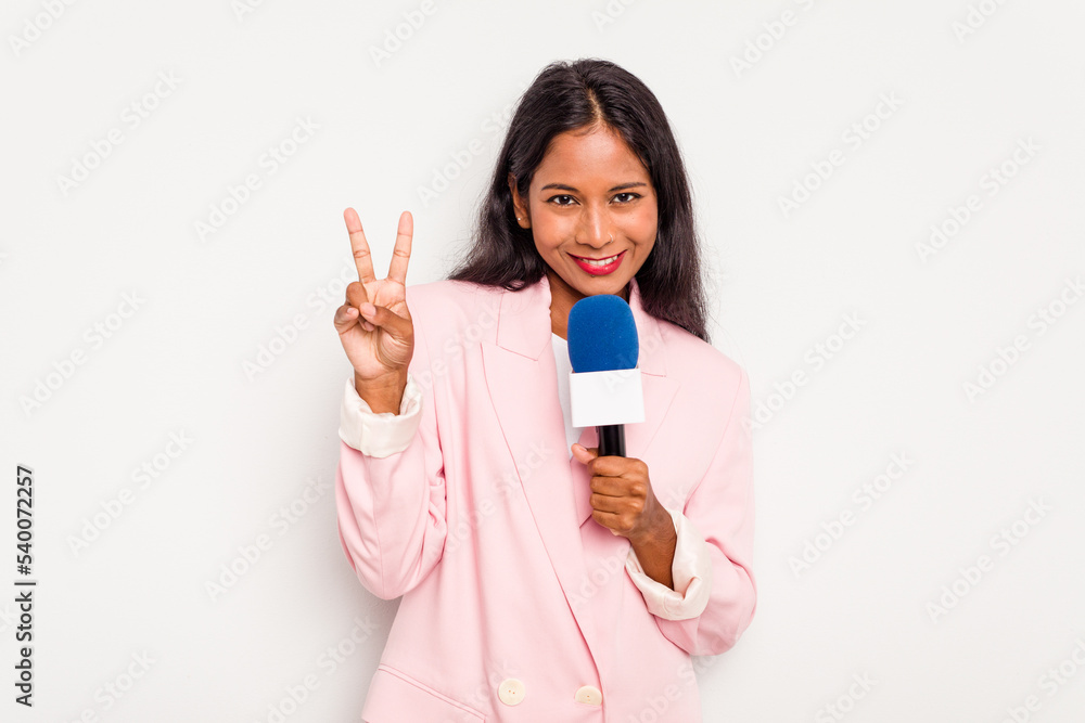 Young TV presenter indian woman isolated on white background showing number two with fingers. Young TV presenter indian woman isolated on white background showing number two with fingers.