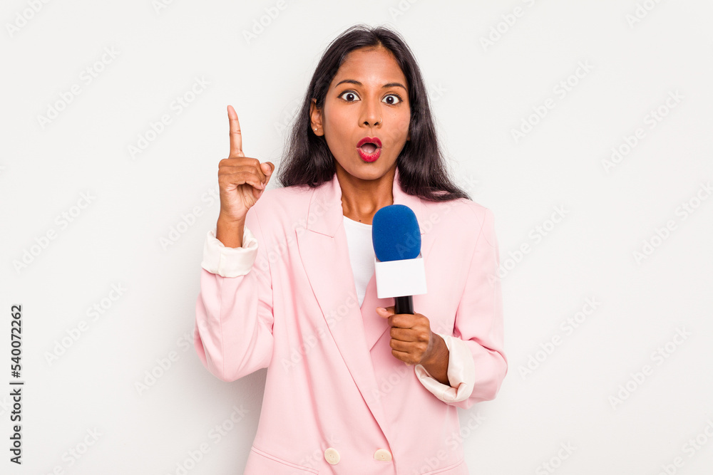 Young TV presenter indian woman isolated on white background having some great idea, concept of creativity. Young TV presenter indian woman isolated on white background having some great idea, concept of creativity.