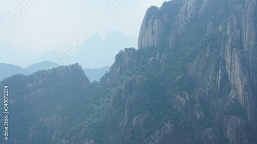 The beautiful mountains landscapes with the green forest and the erupted rock cliff as background in the countryside of the China