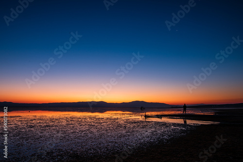 Sunrise by the lake and transition from blue to orange