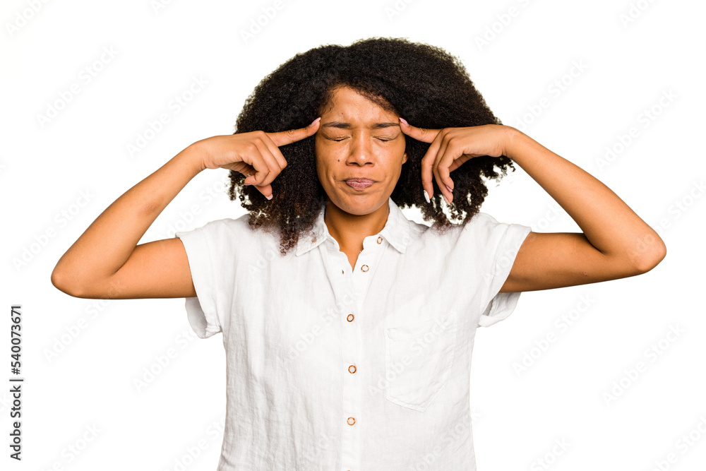 Young African American woman isolated focused on a task, keeping forefingers pointing head. Young African American woman isolated focused on a task, keeping forefingers pointing head.