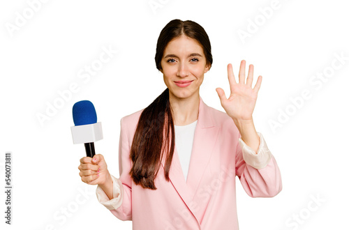 Young TV presenter caucasian woman isolated smiling cheerful showing number five with fingers. photo
