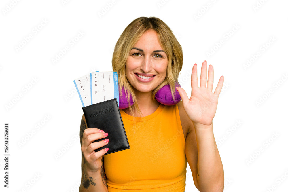 Young caucasian woman with inflatable travel pillow holding passport isolated on green chroma background smiling cheerful showing number five with fingers. Young caucasian woman with inflatable travel pillow holding passport isolated on green chroma background smiling cheerful showing number five with fingers.