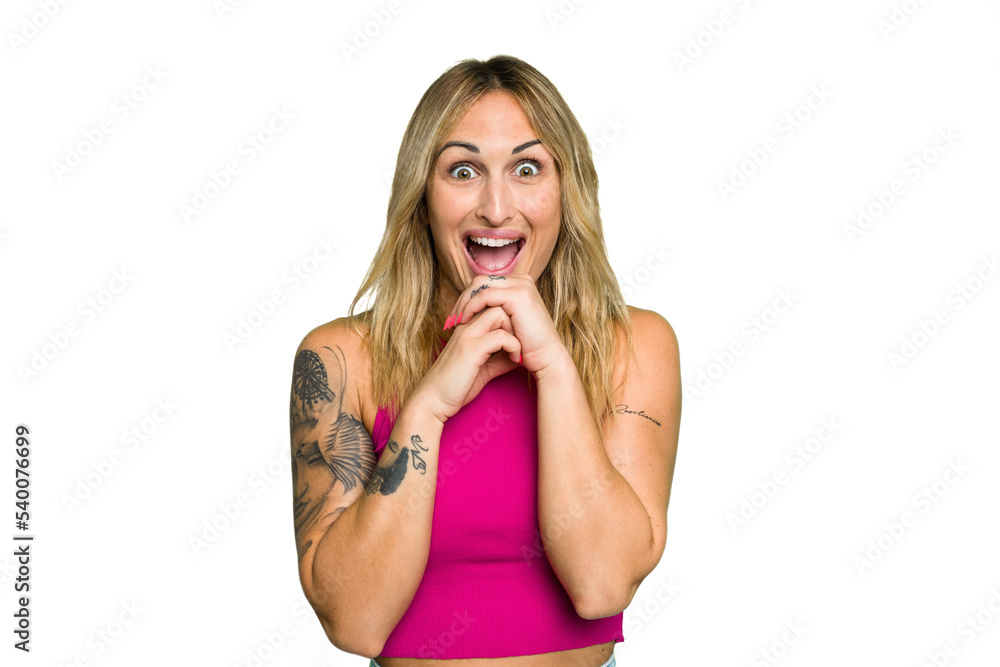 Young caucasian woman isolated on green chroma background praying for luck, amazed and opening mouth looking to front. Young caucasian woman isolated on green chroma background praying for luck, amazed and opening mouth looking to front.