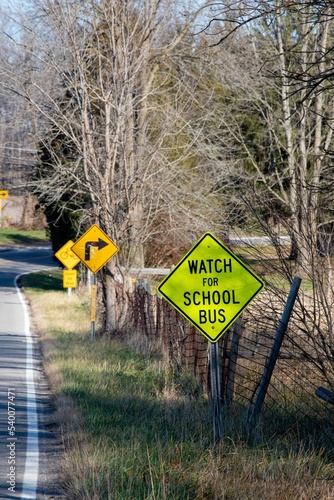 Vertical shot of information road signs on country road in Indiana on sunny day