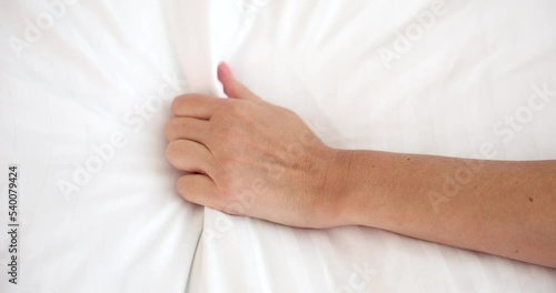 Female hand squeezing white sheet during orgasm closeup 4k movie slow motion