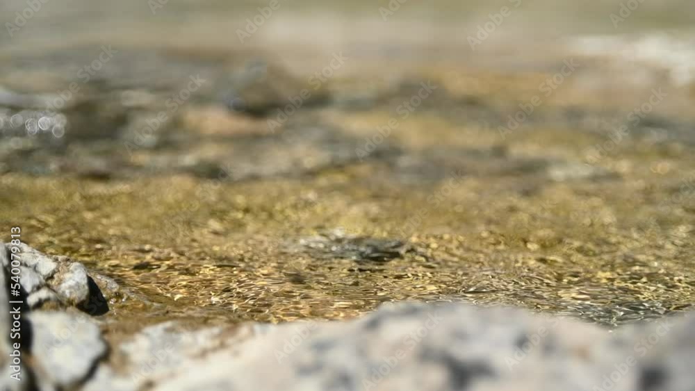 Sunlight creates effects in a mountain stream (slow motion, bohek) Sunlight creates effects in a mountain stream (slow motion, bohek)