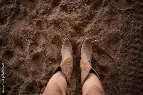 cowgirl boots in the dirt