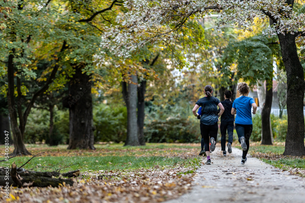 Woman running in budapest park in the afternoon