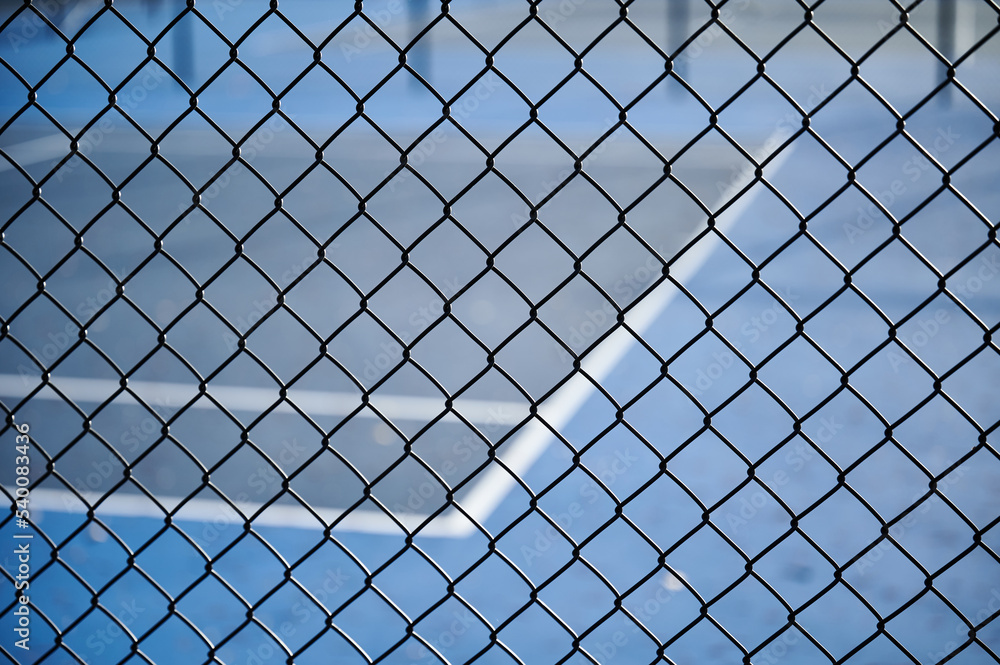link fence with blue tennis court link fence with blue tennis court