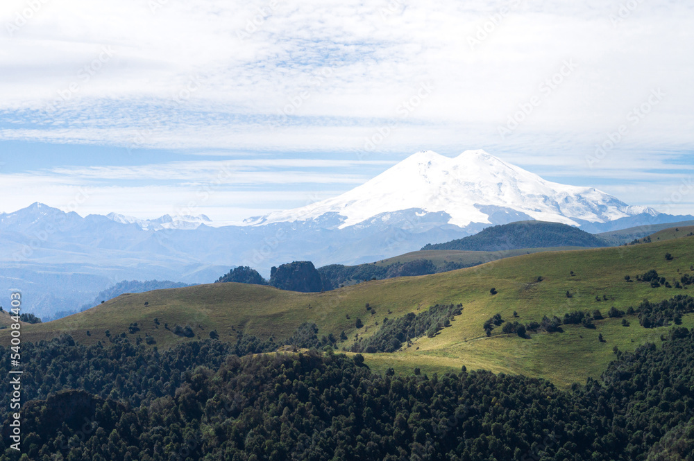 Fototapeta premium Mount Elbrus in summer. hills and meadows of Caucasus