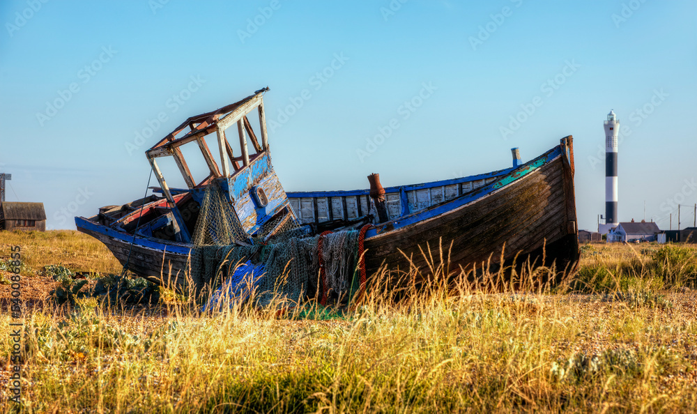 Abandoned Boat Wreck on the Beach at the Dungeness Headland, Kent, England Abandoned Boat Wreck on the Beach at the Dungeness Headland, Kent, England