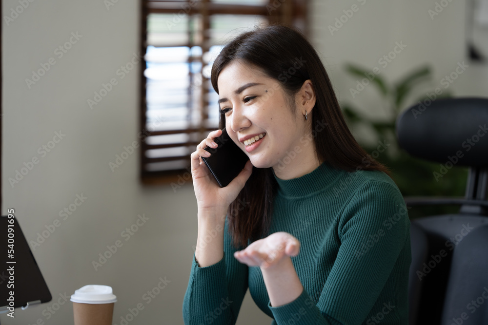 Portrait of successful business woman against a window. Portrait of successful business woman against a window.