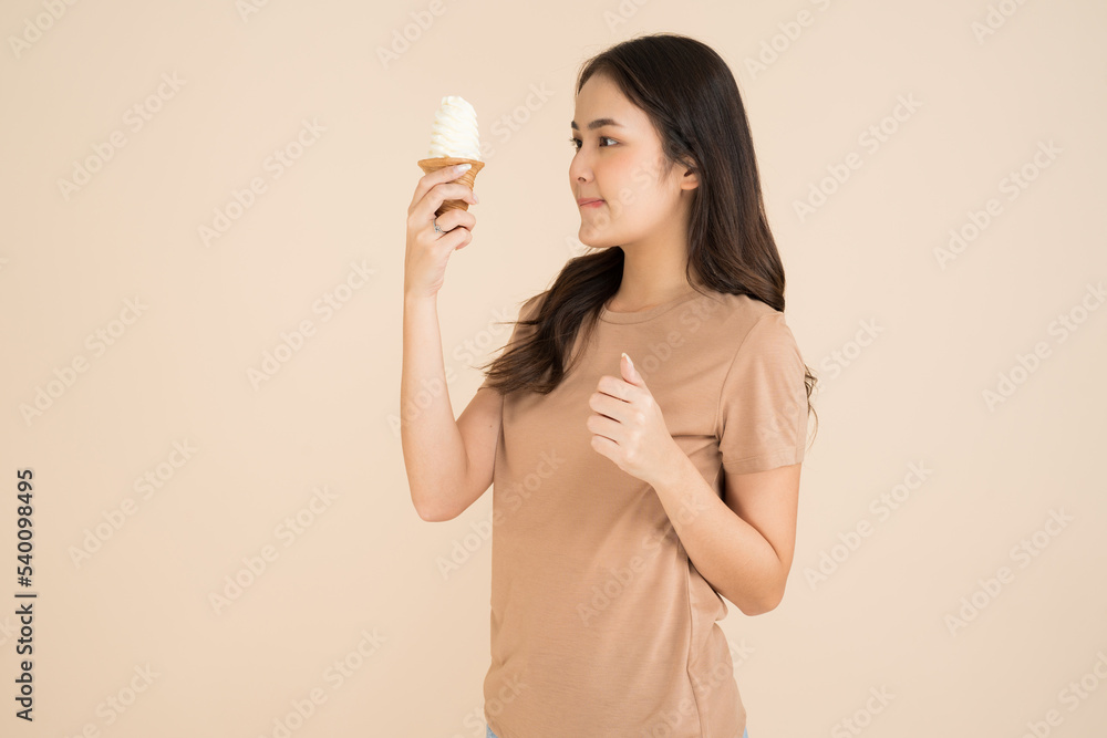 Happy young woman eating ice cream Happy young woman eating ice cream