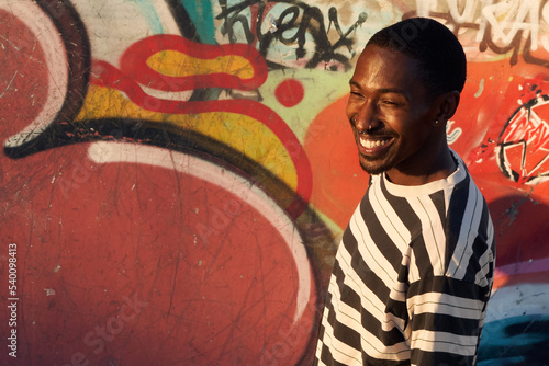 Portrait of young non-binary at skatepark
