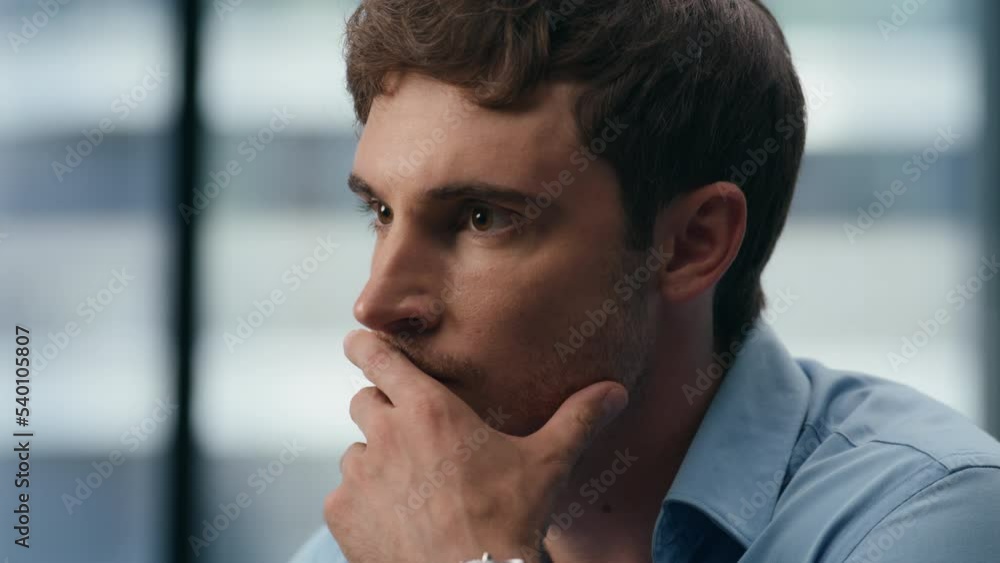 Closeup focused professional working at workplace. Pensive entrepreneur thinking Closeup focused professional working at workplace. Pensive entrepreneur thinking