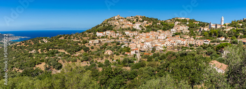View of Corbara village with stone houses built in traditional Corsican style on top of a hill, Corsica, France
