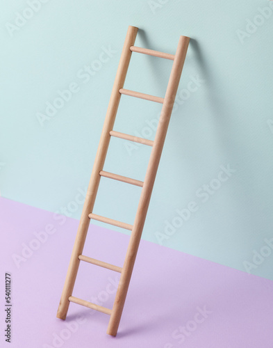 Wooden ladder on a pastel background. Leadership, career growth, business concept. Creative minimal layout