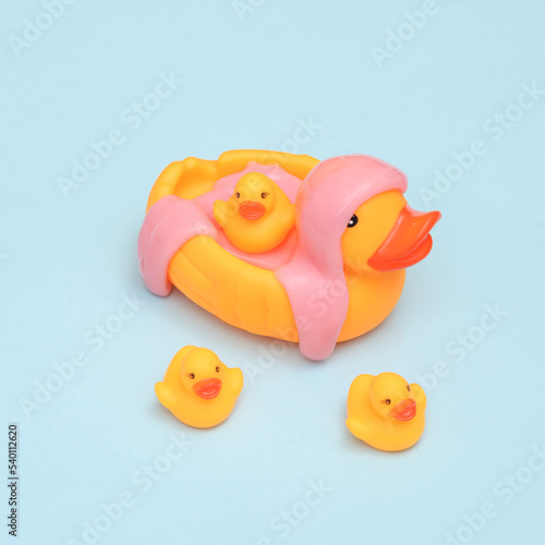 Creative layout, Rubber duck with slime on blue pastel background. Visual trend. Fresh idea. Concept pop