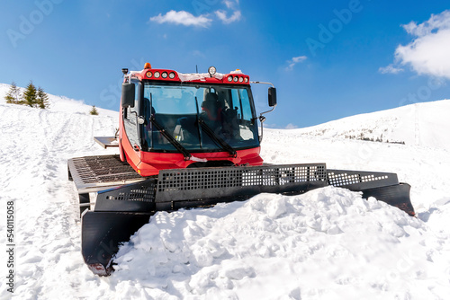 Canvas Print snowcat ratrack with snowplow,snow grooming machine,remover truck prepare ski sl