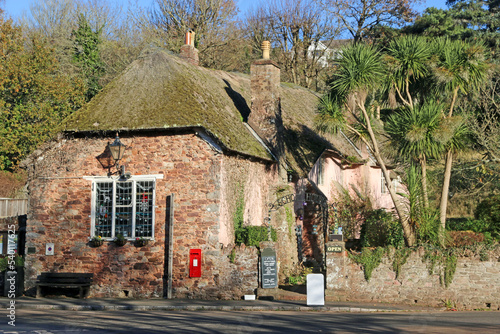 Historic thatched cottage in Cockington village, Devon photo