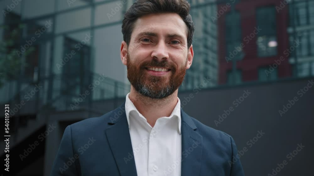 Attractive bearded successful rich man 40s businessman investor leader millennial posing outside modern office building company in downtown city adult male portrait of professional business employee Attractive bearded successful rich man 40s businessman investor leader millennial posing outside modern office building company in downtown city adult male portrait of professional business employee