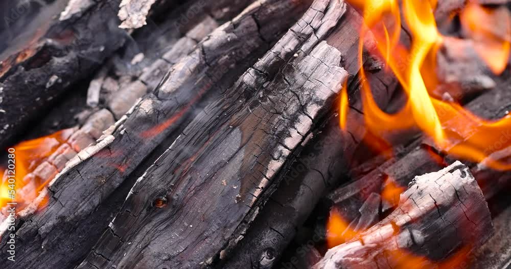 Burning logs and boards in the fire, kindling a fire for barbecue Burning logs and boards in the fire, kindling a fire for barbecue