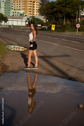 Outdoor portrait of a brunette young woman