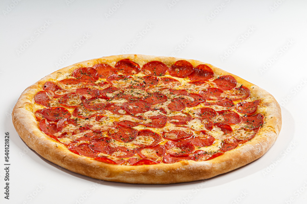 Pepperoni pizza on white background. Copy space. Selective focus