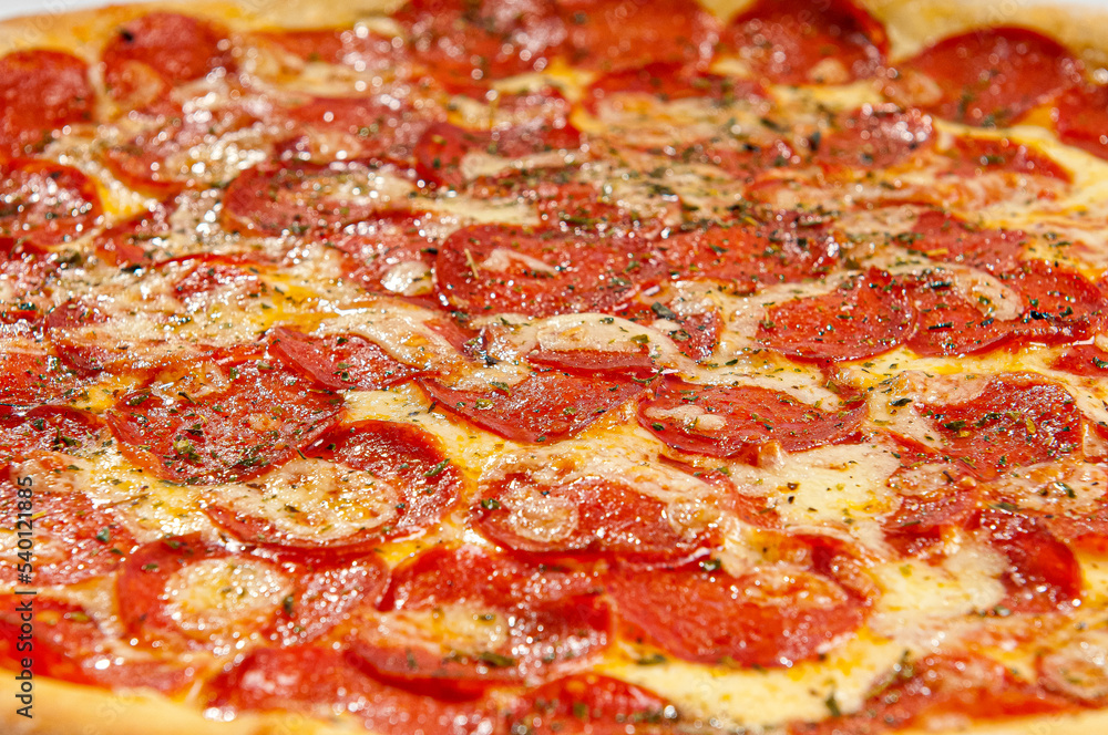 Pepperoni pizza on white background. Copy space. Selective focus Pepperoni pizza on white background. Copy space. Selective focus