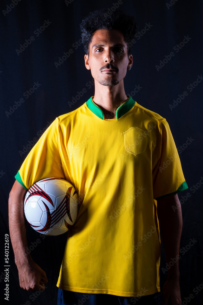 Brazilian Football Black Player Holding Ball and Celebrating