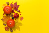 Festive autumn flat lay with pumpkins, berries and leaves on color background, top view