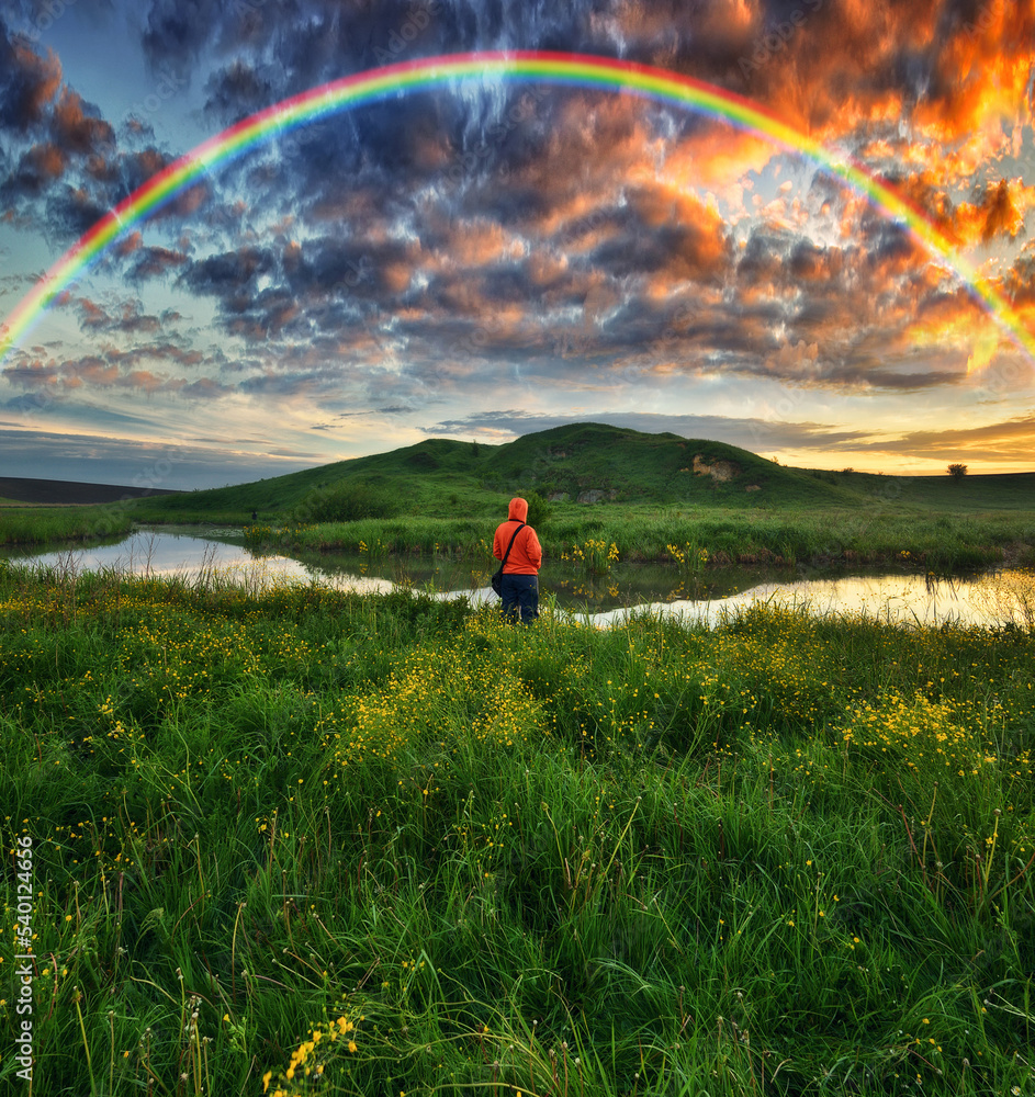 Woman Looking At Rainbow. rainbow over the river. nature of Ukraine Woman Looking At Rainbow. rainbow over the river. nature of Ukraine