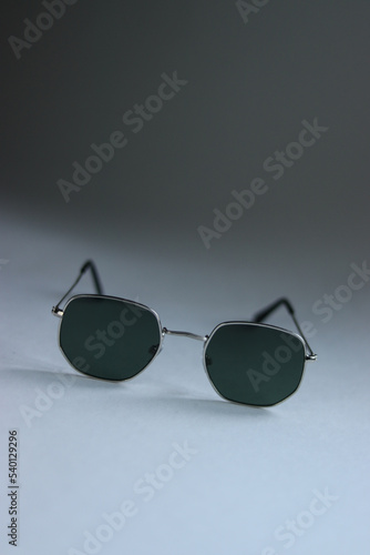 sunglasses on a white background.sunglasses close-up.men's glasses on a white background.women's glasses on a white background.black sunglasses on a white table