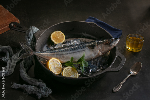 Raw fish presented in a metal dish
