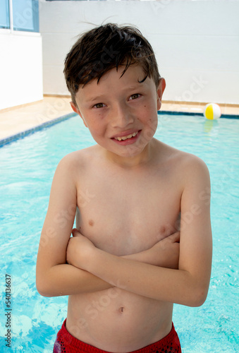 Happy american boy in swimsuit