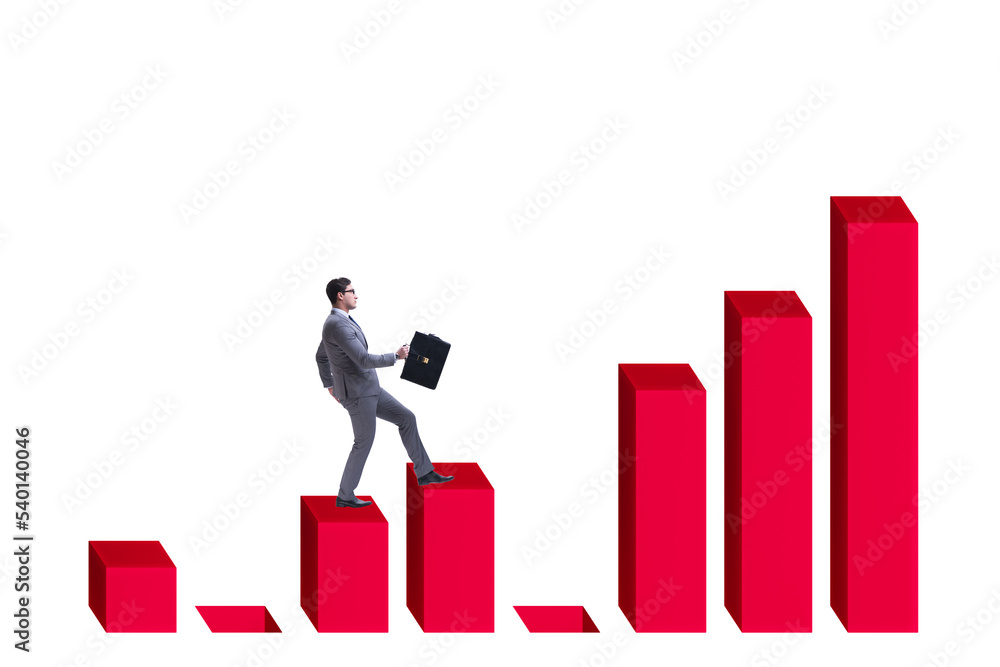 Businessman in growth concept with bar charts Businessman in growth concept with bar charts