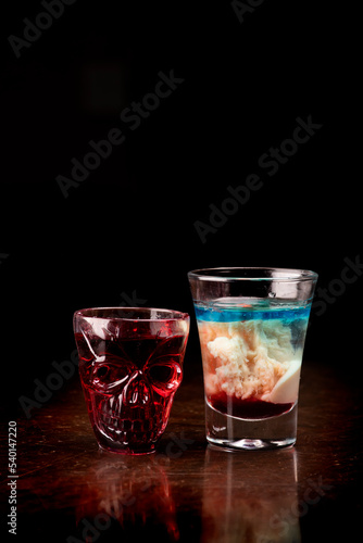 creepy halloween shot in skull cup and brain hemorrhage shot on dark background front view