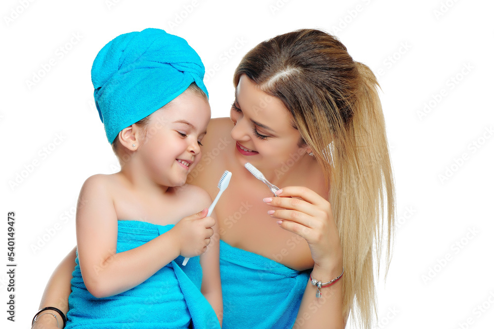 Little girl looking at toothbrush Little girl looking at toothbrush