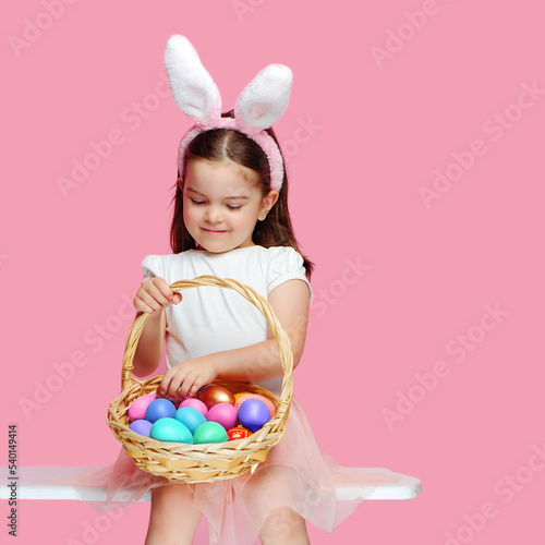 Girl counting eggs after Easter egg hunt